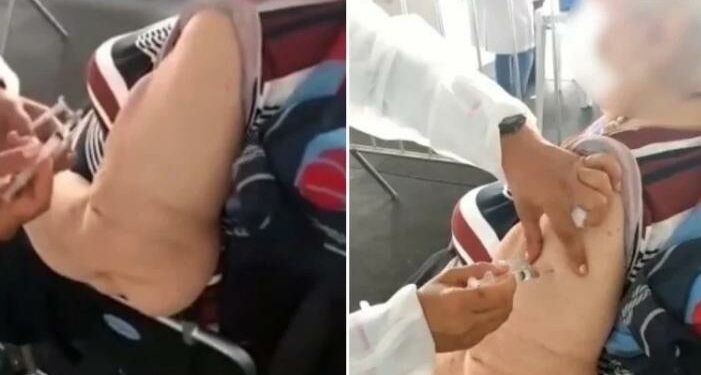 Técnica de enfermagem é afastada após ser flagrada fingindo aplicar vacina em idosa