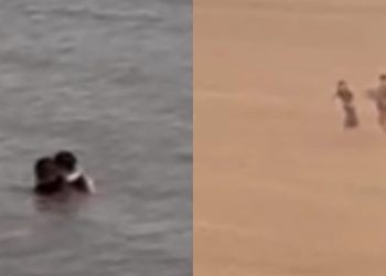 ​Mesmo com Ponta Negra interditada, casal aproveita pra dar uma rapidinha refrescante