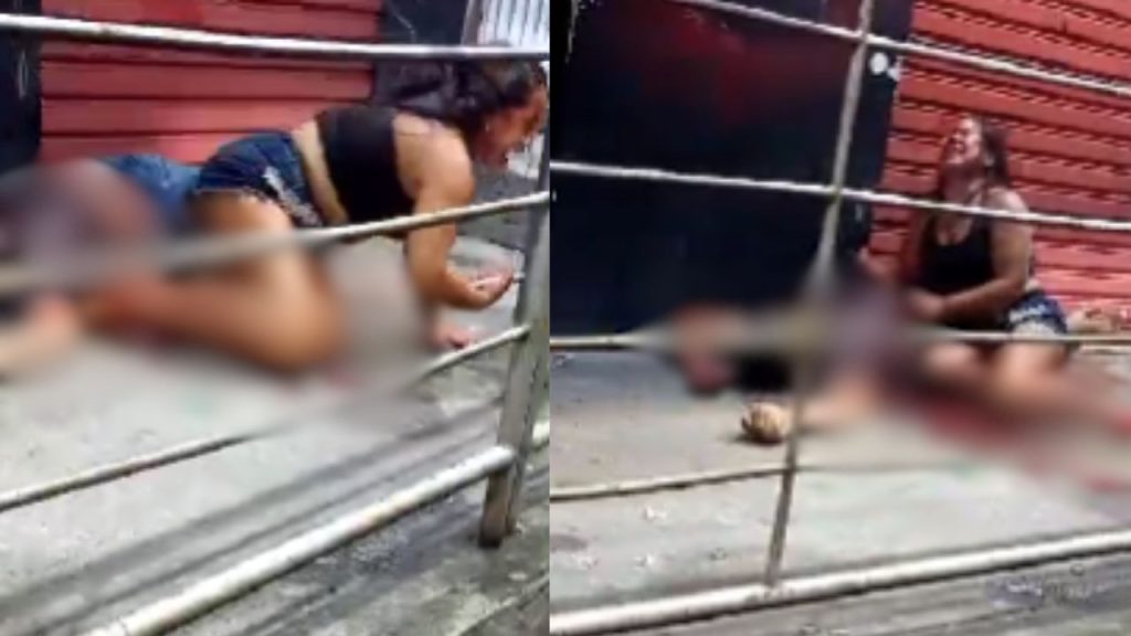 Esposa chora diante do corpo do marido morto a tiros em bar da zona leste de Manaus