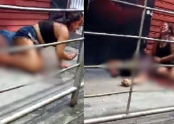 Esposa chora diante do corpo do marido morto a tiros em bar da zona leste de Manaus