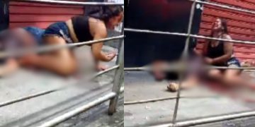 Esposa chora diante do corpo do marido morto a tiros em bar da zona leste de Manaus