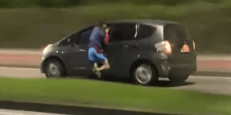 Vídeo mostra ladrão sendo arrastado por carro ao tentar roubar o celular do motorista