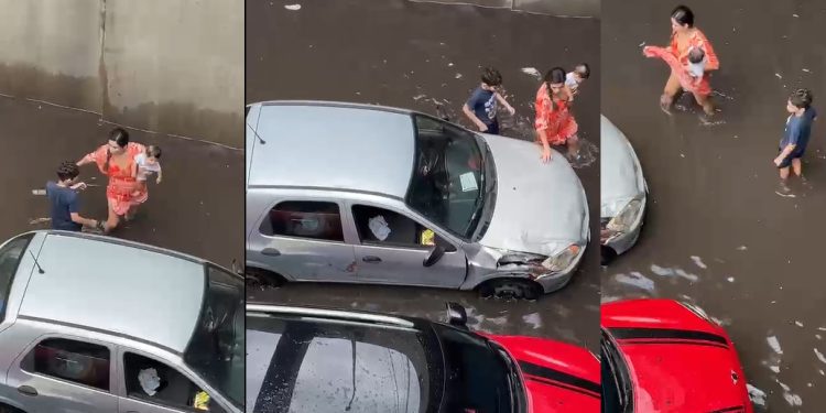 Vídeo: mãe sai do carro com os filhos na alagação em Manaus e cena viraliza nas redes sociais
