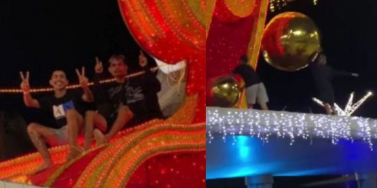 Vídeo: Influenciador sobe em estrutura natalina na Ponta Negra e dá s0c0s e chut3s