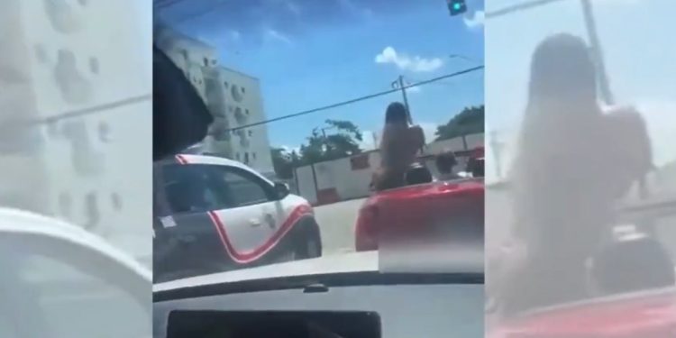 Vídeo: mulher reb0la em cima da BMW e mostra os sei0s para viatura da PM