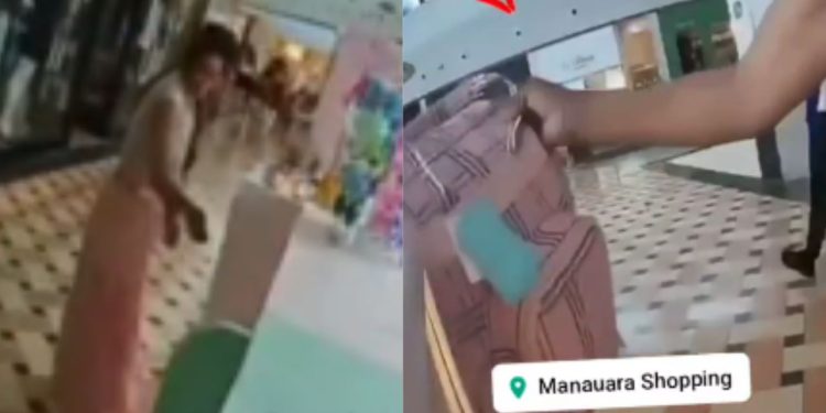 Câmera flagra mulher tentando furt4r bolsa de quiosque no Manauara Shopping