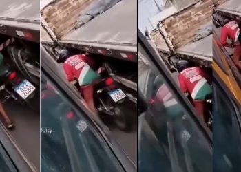 Vídeo: motoqueiro tenta passar entre ônibus e caminhão e acaba exprimido  